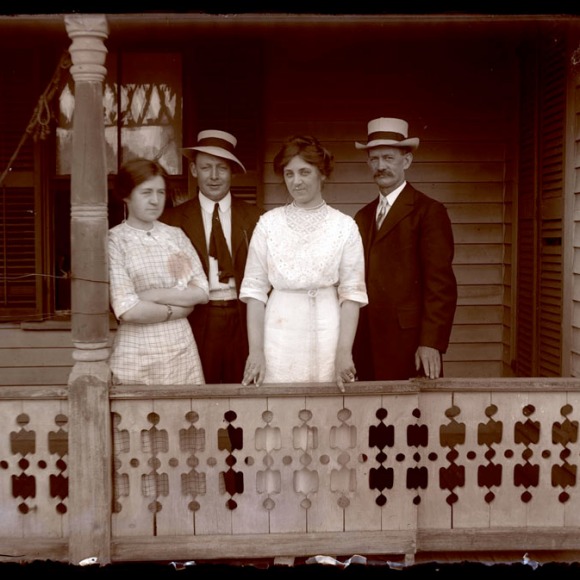 Two couples pose on the front porch of a Hartford house, ca. 1920. CHS 1995.36.1591